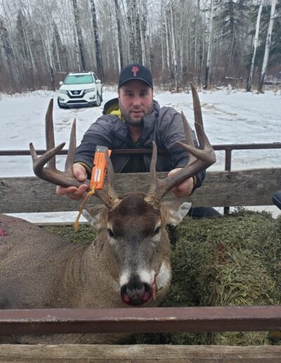 Hunter with Whitetail Deer